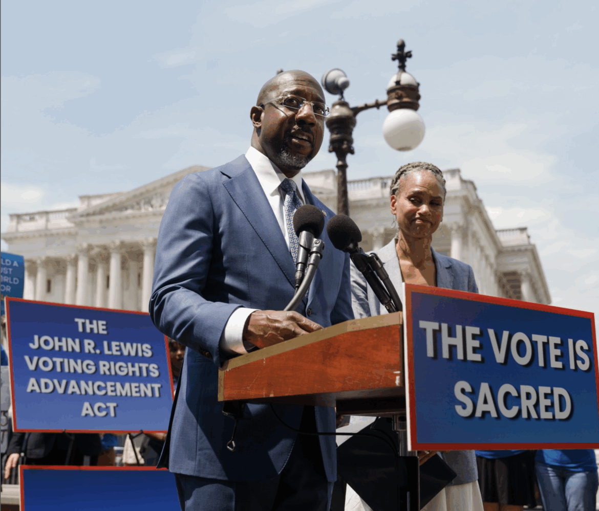 A photo of U.S. Sen Raphael Warnock speaking at a press conference in July about the John R. Lewis Voting Rights Advancement Act.
