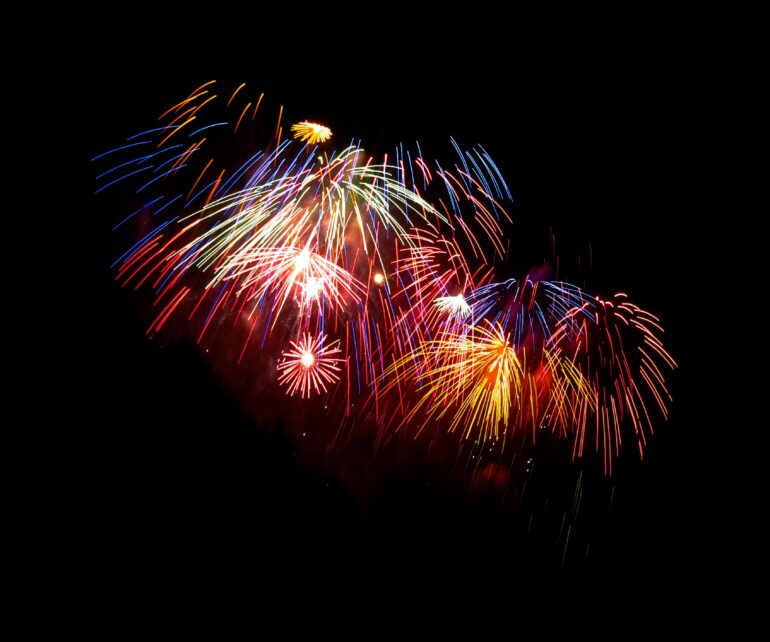 Vibrant fireworks in the night sky.