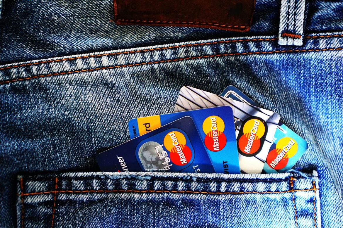 Credit cards in the back pocket of a pair of blue jeans.