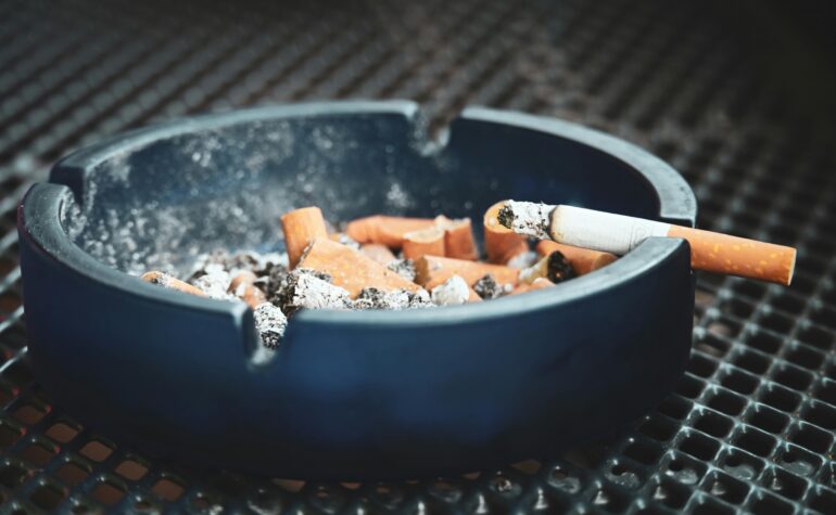 An ashtray full of cigarette butts.
