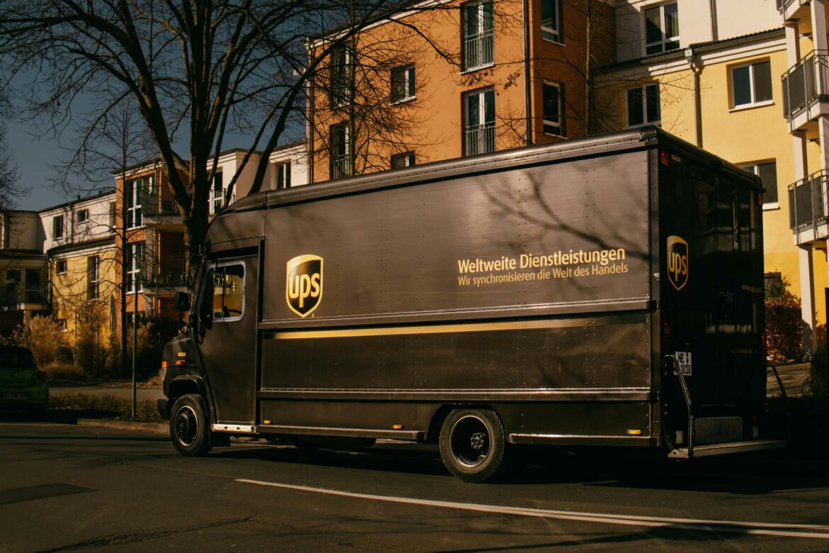 A UPS truck passing through the neighborhood.
