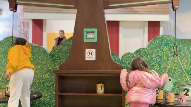 Children playing with the new interactive measurement exhibit at the Tellus Museum.