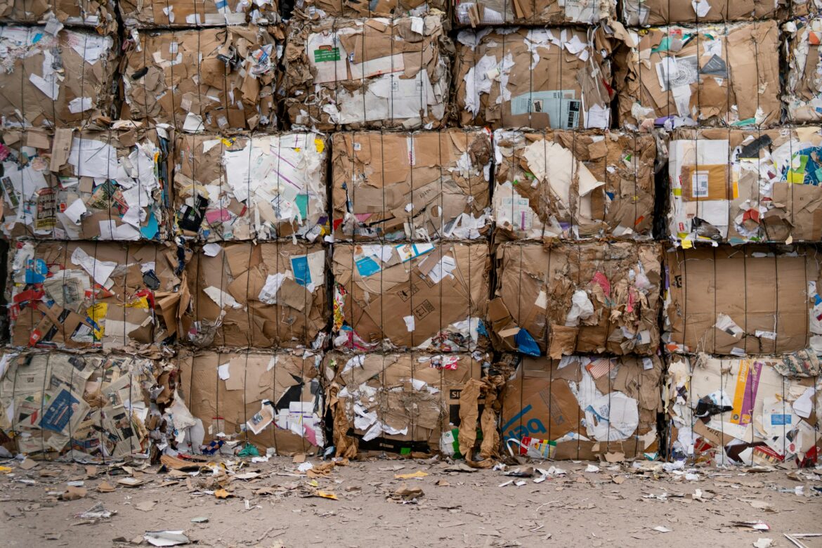 A photo of boxes of recyclable material stacked on each other.
