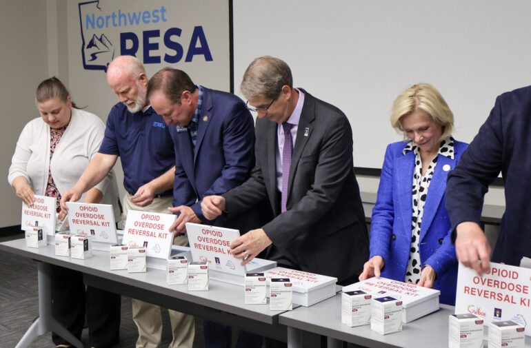 State leaders, agency officials and volunteers assemble 180 opioid overdose reversal kits at a “Stuff the Box” event Tuesday before distributing them to Northwest Georgia public schools.