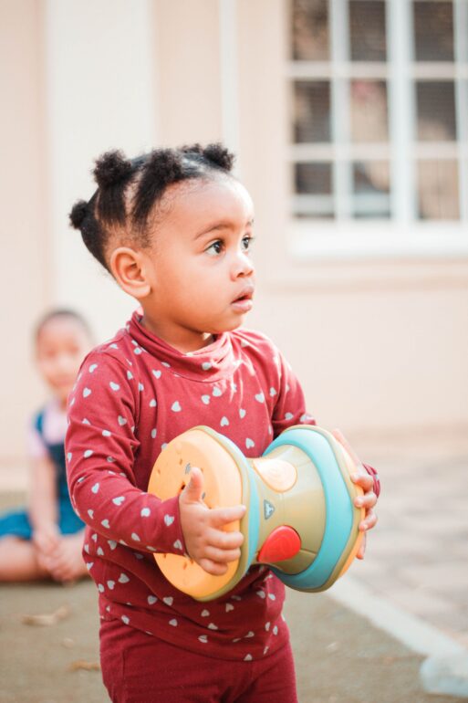 A young girl playing outside