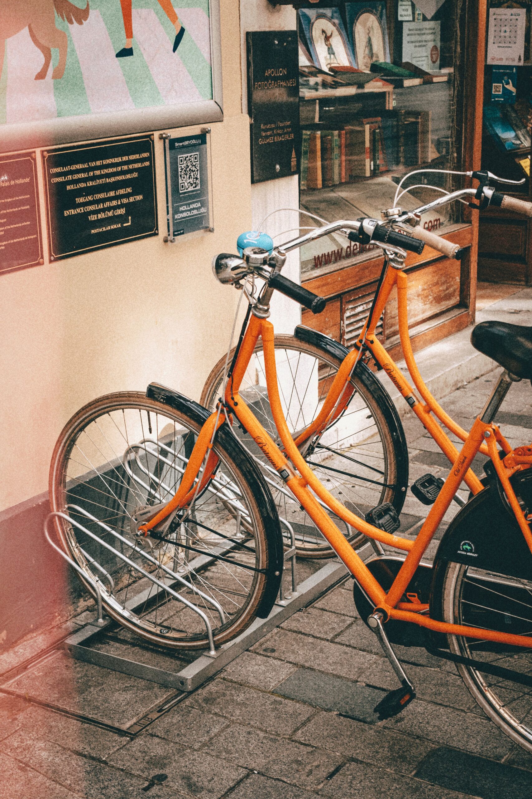 two bicycles parked outside a business