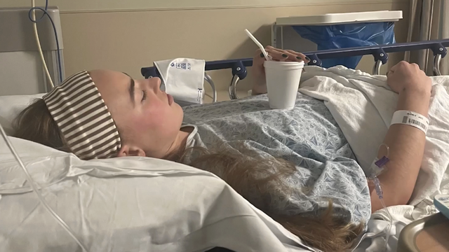 A 24-year-old nurse laying in a hospital bed