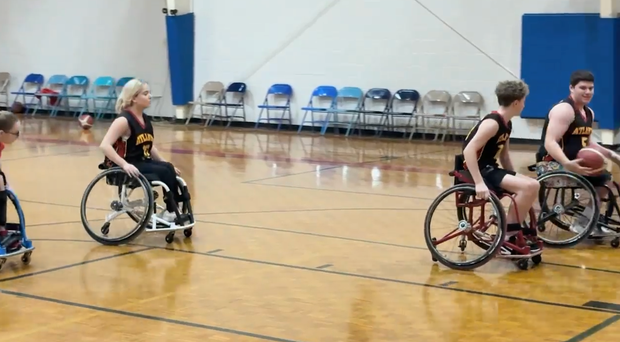 A screenshot of team members of BlazeSports Junior Hawks on the basketball court.
